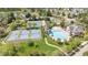 Aerial view of a community pool and tennis courts surrounded by lush landscaping at 308 Apricot Cir, Morrisville, NC 27560