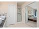 Bright bathroom featuring a glass shower, a white vanity with a marble countertop, and bedroom access at 308 Apricot Cir, Morrisville, NC 27560