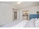 Cozy bedroom with views into ensuite bathroom, a double door closet and light color scheme at 308 Apricot Cir, Morrisville, NC 27560