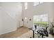 Bright and airy living space with soaring ceilings, wood floors, with designated work area at 308 Apricot Cir, Morrisville, NC 27560
