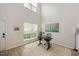 Bright and airy living space with soaring ceilings, wood floors, with designated work area at 308 Apricot Cir, Morrisville, NC 27560