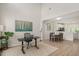 Open-concept living space with soaring ceilings, wood floors, with designated area for work and dining space at 308 Apricot Cir, Morrisville, NC 27560
