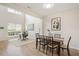 Open-concept living space with soaring ceilings, wood floors, with designated area for work and dining space at 308 Apricot Cir, Morrisville, NC 27560