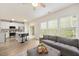 Spacious and bright living area featuring a kitchen with island, open living room and many windows at 308 Apricot Cir, Morrisville, NC 27560