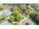 Aerial view of the community playground surrounded by mature trees near the tennis courts at 308 Apricot Cir, Morrisville, NC 27560