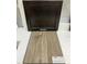 Interior selections featuring dark cabinetry, and luxury vinyl wood flooring at 344 Chesapeak Commons St # 138, Garner, NC 27529