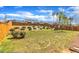 Fenced backyard with a playset, a grassy lawn, and a garden area, perfect for outdoor enjoyment at 350 Stephens Way, Youngsville, NC 27596