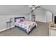 Bedroom with vaulted ceilings, ceiling fan, and blue bed featuring a unicorn patterned cover at 350 Stephens Way, Youngsville, NC 27596
