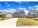 Lovely home with gray siding, stone accents, a long driveway, and a neatly kept lawn at 350 Stephens Way, Youngsville, NC 27596