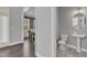 Charming powder room with unique flooring and a pedestal sink near dining room and entry at 350 Stephens Way, Youngsville, NC 27596