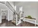 Inviting staircase with wood and metal railings, leading to the upper level, with hardwood floors at 350 Stephens Way, Youngsville, NC 27596