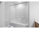 Bathroom featuring a white bathtub and shower, along with a clean toilet at 3735 Landshire View Ln, Raleigh, NC 27616
