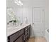 Bathroom with double vanity, white countertops, and white cabinets at 3735 Landshire View Ln, Raleigh, NC 27616