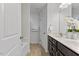 Bathroom with double vanity, tile floor, and white cabinets at 3735 Landshire View Ln, Raleigh, NC 27616