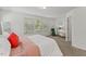 Bright bedroom with neutral walls, carpet, and an accent chair at 3735 Landshire View Ln, Raleigh, NC 27616