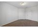 Spacious bedroom featuring neutral walls, and carpet, with two doors at 3735 Landshire View Ln, Raleigh, NC 27616