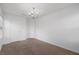 Bedroom featuring carpet, neutral walls and a chandelier at 3735 Landshire View Ln, Raleigh, NC 27616