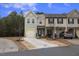 Charming townhome featuring a two-car garage, well-maintained lawn, and welcoming curb appeal at 3735 Landshire View Ln, Raleigh, NC 27616