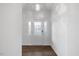 Bright foyer with white walls, tiled floors, and elegant glass-paneled front door at 3735 Landshire View Ln, Raleigh, NC 27616