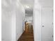 Hallway featuring dark wood floors and neutral walls at 3735 Landshire View Ln, Raleigh, NC 27616