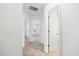 Bright hallway with multiple doorways, light neutral paint, and clean, neutral carpeting at 3735 Landshire View Ln, Raleigh, NC 27616