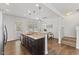 Well-lit kitchen featuring granite countertops, stainless steel appliances, and bar top seating at 3735 Landshire View Ln, Raleigh, NC 27616