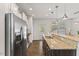 Well-lit kitchen featuring granite countertops, stainless steel appliances, and ample cabinet space at 3735 Landshire View Ln, Raleigh, NC 27616