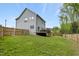 Backyard view with a deck, a soccer goal and a fenced perimeter at 375 Alcock Ln, Youngsville, NC 27596
