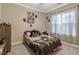Bright bedroom featuring carpet, a bed, curtains, and neutral paint at 375 Alcock Ln, Youngsville, NC 27596