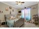 Charming bedroom with carpet, neutral paint, a bed, and colorful curtains at 375 Alcock Ln, Youngsville, NC 27596