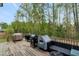 Spacious backyard deck with grills and outdoor seating at 375 Alcock Ln, Youngsville, NC 27596