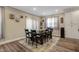 Dining room featuring plank floors, a modern light fixture, and neutral colored walls at 375 Alcock Ln, Youngsville, NC 27596