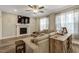 Comfortable living room with hardwood floors, fireplace, large windows, and lots of natural light at 375 Alcock Ln, Youngsville, NC 27596