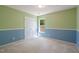 Cozy bedroom with two-tone walls and double-door closet at 378 E Raleigh Ave, Liberty, NC 27298
