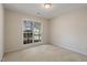Well-lit bedroom with a large window offering ample natural light at 378 E Raleigh Ave, Liberty, NC 27298