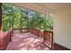 Spacious back deck, perfect for outdoor enjoyment with lush greenery views at 378 E Raleigh Ave, Liberty, NC 27298