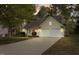 Inviting home showcasing a well-manicured lawn, a two-car garage, and classic exterior finishes at 378 E Raleigh Ave, Liberty, NC 27298