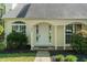 Inviting front entrance showcasing decorative columns and a well maintained lawn at 378 E Raleigh Ave, Liberty, NC 27298