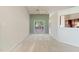 View of a living room with a large window overlooking a deck, painted in neutral colors at 378 E Raleigh Ave, Liberty, NC 27298