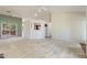 Spacious living room with high ceilings, a view into the kitchen, and access to an outdoor deck at 378 E Raleigh Ave, Liberty, NC 27298