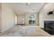 Inviting living room with large windows, a fireplace, and an entrance, offering bright and open space at 378 E Raleigh Ave, Liberty, NC 27298