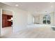 Bright living room with kitchen access, featuring large windows and a fireplace, ample space at 378 E Raleigh Ave, Liberty, NC 27298