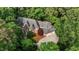 Aerial view of an estate home surrounded by mature trees, driveway, and manicured landscaping at 417 Swans Mill Xing, Raleigh, NC 27614