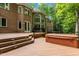 Large brick home with multiple decks and a hot tub overlooking a spacious backyard at 417 Swans Mill Xing, Raleigh, NC 27614