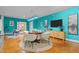 Open-concept basement featuring a game table with chairs and an entertainment center with a TV at 417 Swans Mill Xing, Raleigh, NC 27614