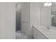 Bright bathroom featuring a walk-in shower and white vanity with ample storage space at 417 Swans Mill Xing, Raleigh, NC 27614