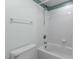 Full bathroom showcasing a clean, white tub and shower combination with tiled walls and trim at 417 Swans Mill Xing, Raleigh, NC 27614
