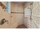Walk-in shower with tile walls and glass block window at 417 Swans Mill Xing, Raleigh, NC 27614