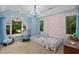 bedroom with hardwood floors and colorful accent wall at 417 Swans Mill Xing, Raleigh, NC 27614
