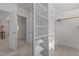 Walk-in closet with built-in shelving and carpet floors at 417 Swans Mill Xing, Raleigh, NC 27614